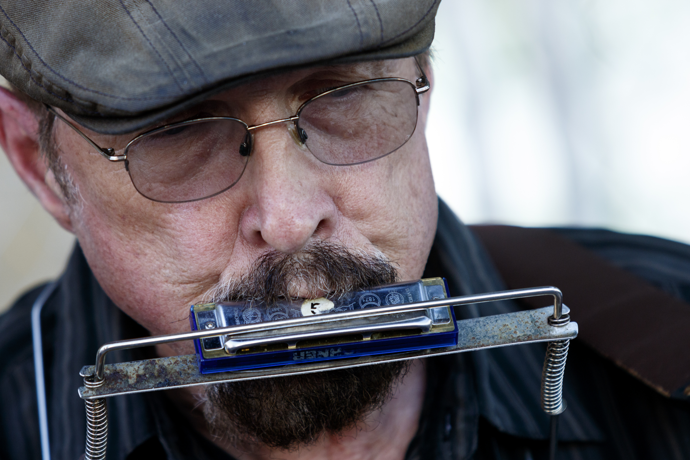 John Lathin plays harmonica as he performs on the 1st day of the Riverbend Festival at Ross's Landing on Friday, June 10, 2016, in Chattanooga, Tenn. The festival is celebrating its 35th year, and Thomas Rhett was Friday night's headlining act.