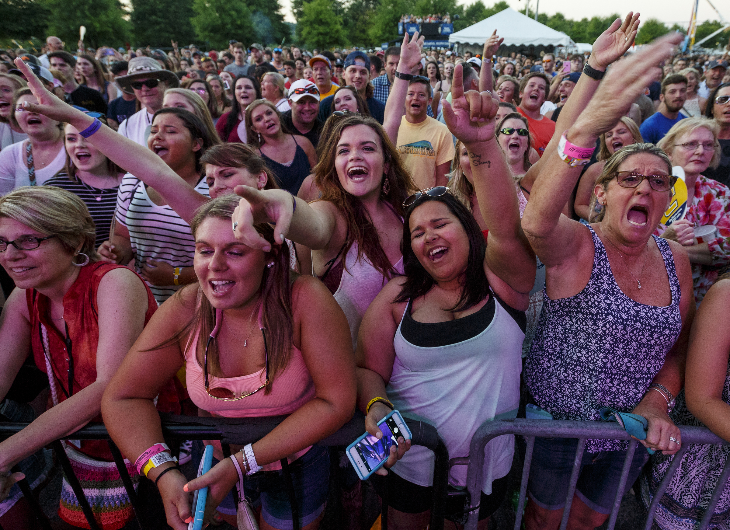 Fans cheer for Chris Lane as he performs on the 1st day of the Riverbend Festival at Ross's Landing on Friday, June 10, 2016, in Chattanooga, Tenn. The festival is celebrating its 35th year.