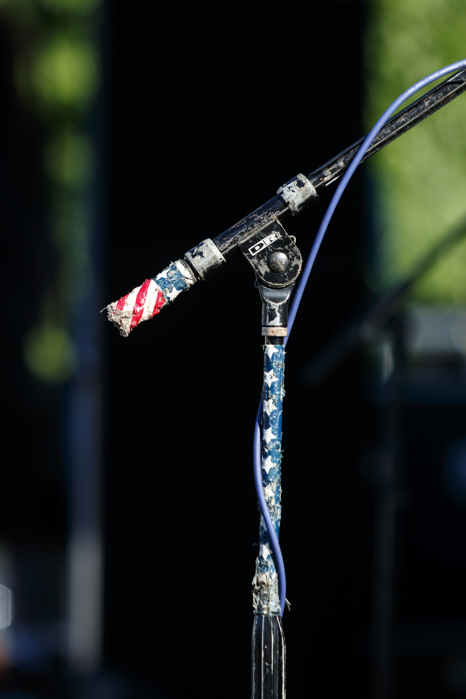 A microphone stand is taped with an American flag decal on the 1st day of the Riverbend Festival at Ross's Landing on Friday, June 10, 2016, in Chattanooga, Tenn. The festival is celebrating its 35th year, and Thomas Rhett was Friday night's headlining act.