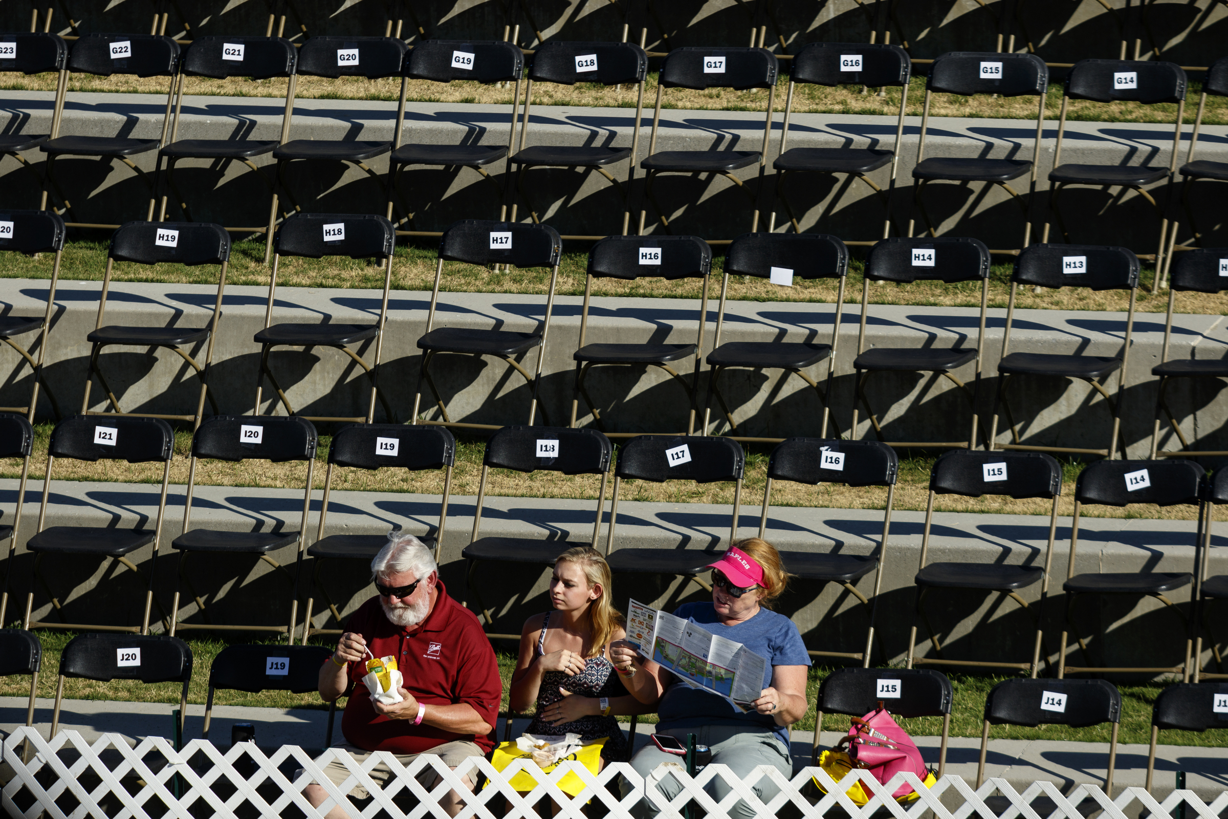 A trio of people sit in reserved VIP seating for the performance of early Coca Cola stage headliner ZZ Ward on the 1st day of the Riverbend Festival at Ross's Landing on Friday, June 10, 2016, in Chattanooga, Tenn. The festival is celebrating its 35th year, and Thomas Rhett was Friday night's headlining act.