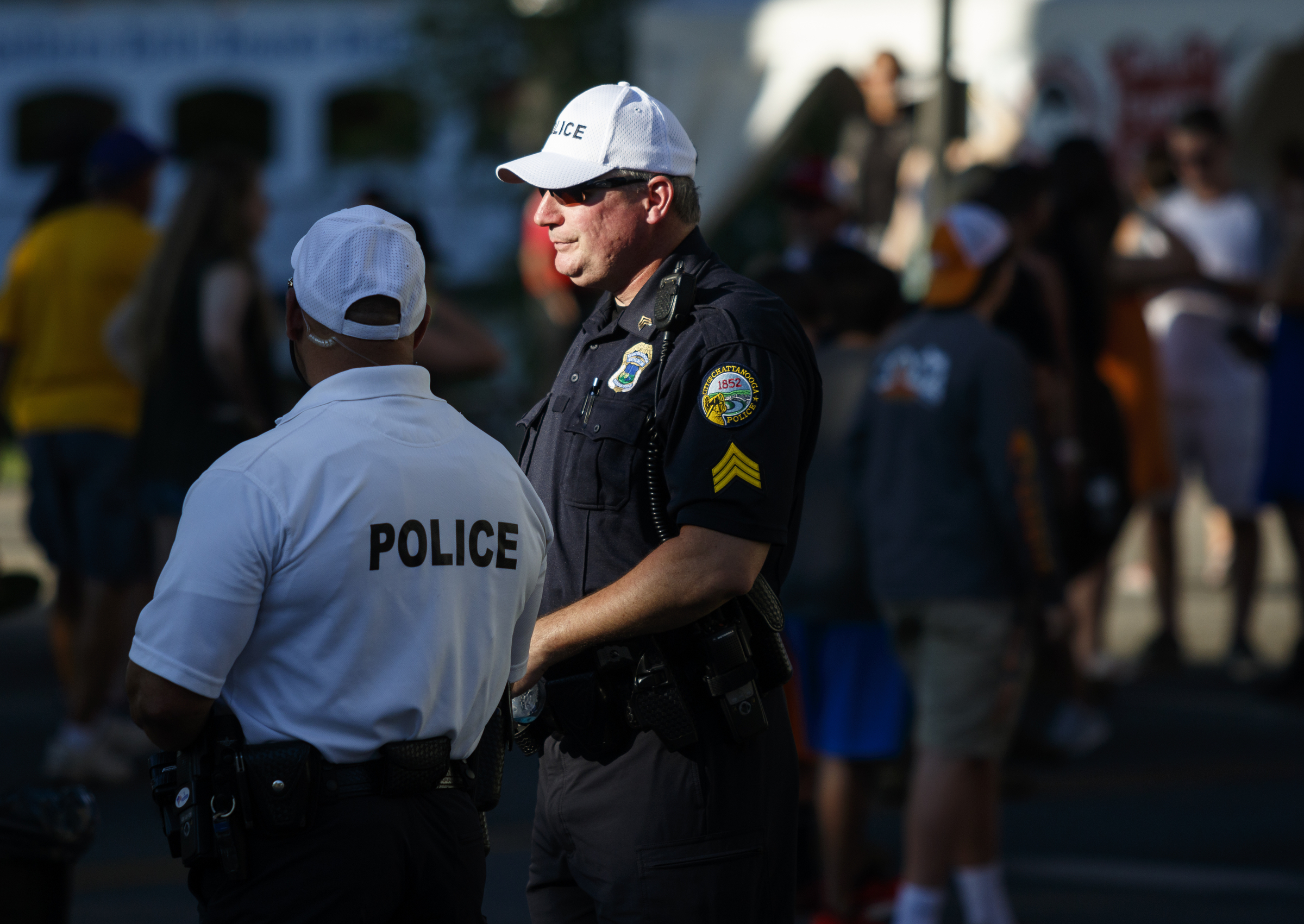 Chattanooga police Sgt. Joe Carpenter, right, and Officer Kevin Otto monitor the crowd beneath the Olgiati Bridge on the 1st day of the Riverbend Festival at Ross's Landing on Friday, June 10, 2016, in Chattanooga, Tenn. The festival is celebrating its 35th year, and Thomas Rhett was Friday night's headlining act.