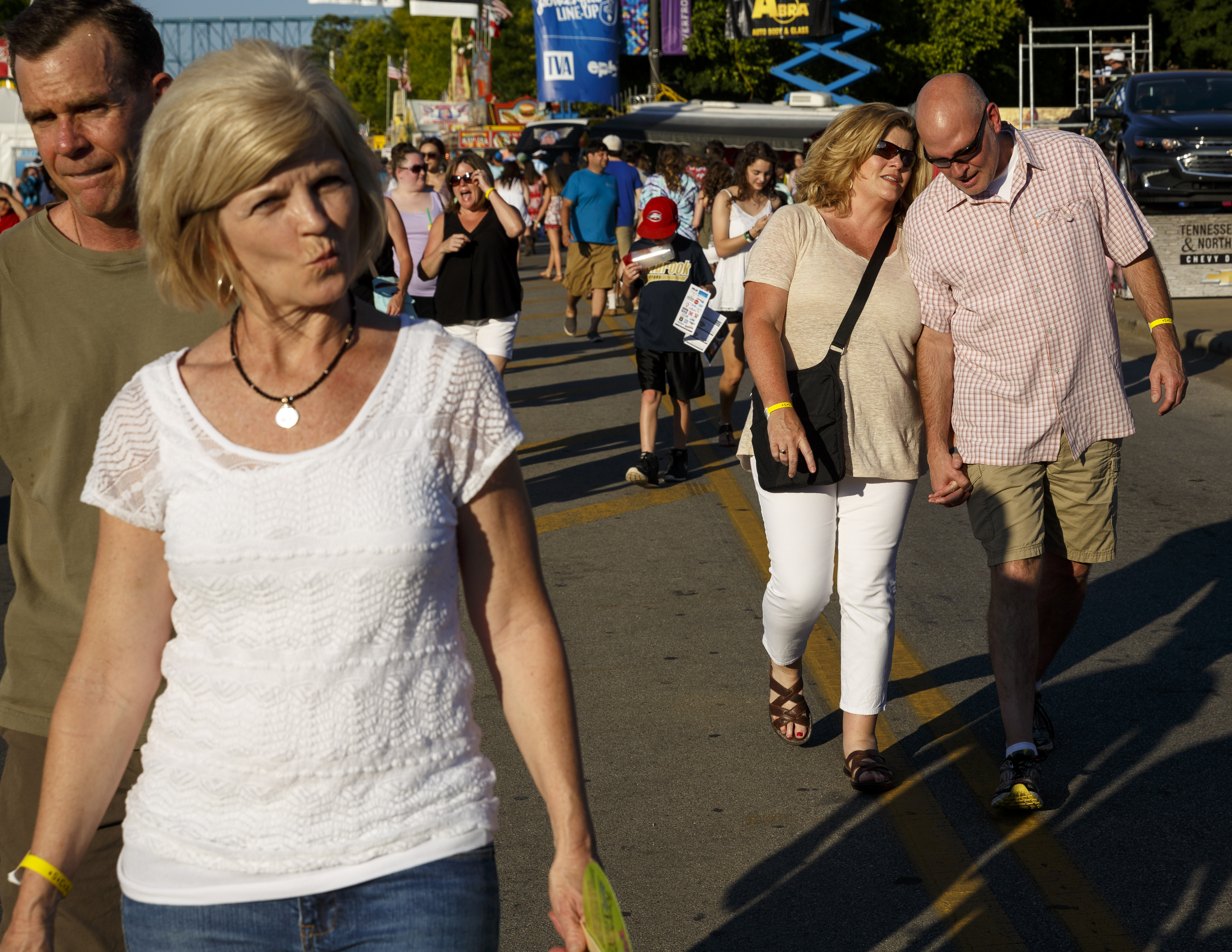 People walk to stages on the 1st day of the Riverbend Festival at Ross's Landing on Friday, June 10, 2016, in Chattanooga, Tenn. The festival is celebrating its 35th year, and Thomas Rhett was Friday night's headlining act.