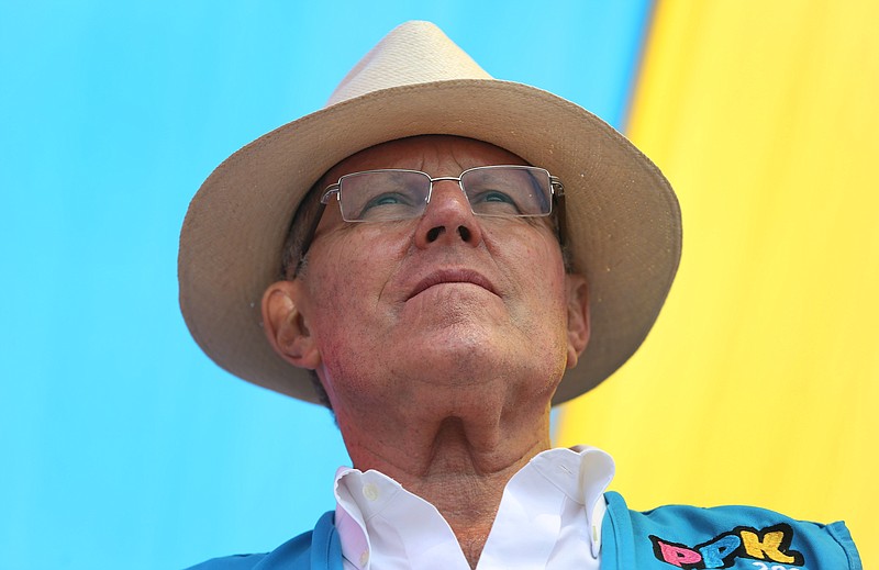 
              FILE - In this May 3, 2016 file photo, presidential candidate Pedro Pablo Kuczynski looks out at his supporters during a rally on the outskirts of Lima, Peru. The former World Bank economist won the majority of votes in Peru's closest presidential contest in five decades. Now that he's won, he must take the reins of one of South America's most ungovernable countries, one awash in illegal proceeds from cocaine trafficking and where social tensions stoked by multinational mining projects frequently erupt into deadly unrest. (AP Photo/Martin Mejia, File)
            