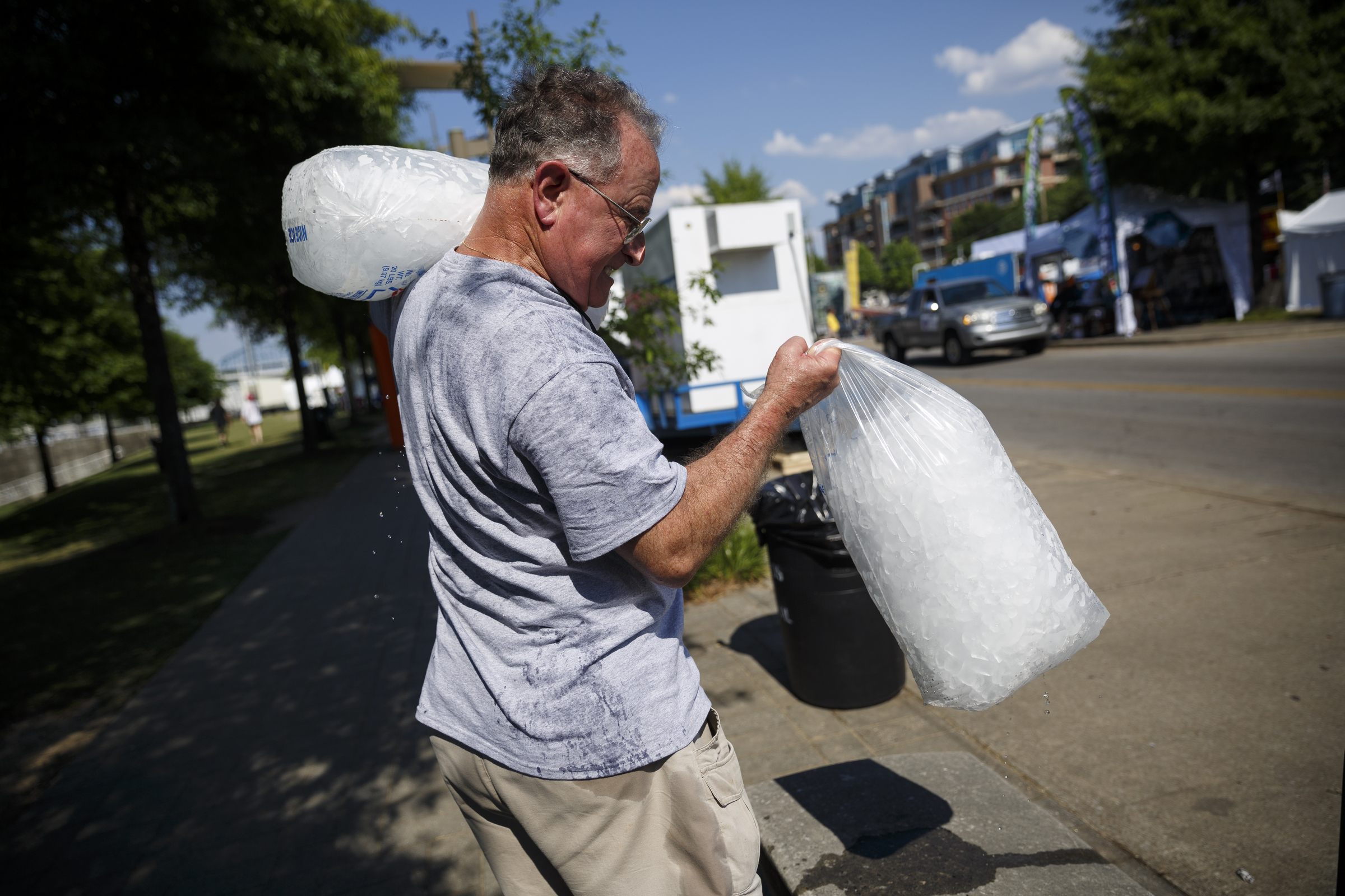 Dan Spahr carries bags of ice to a booth on the 2nd day of the Riverbend Festival at Ross's Landing on Saturday, June 11, 2016, in Chattanooga, Tenn. Rock band Heart headlined Saturday night.