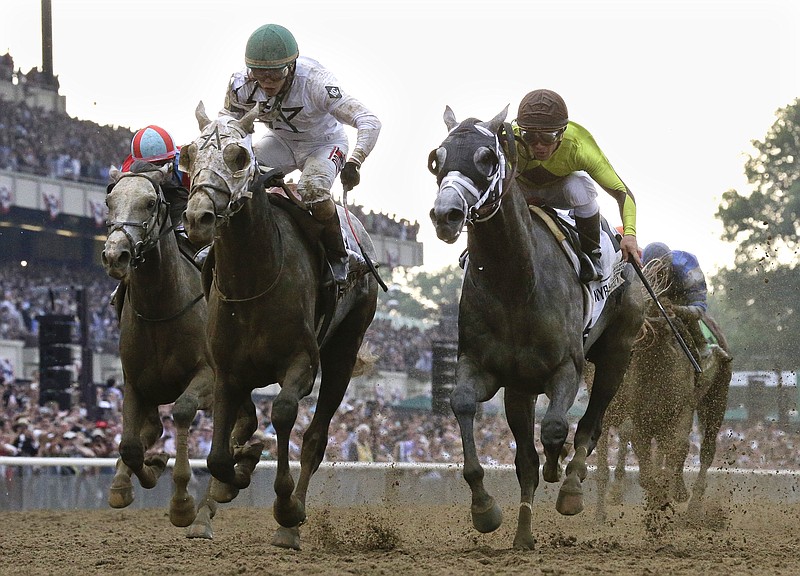 Creator, left, with jockey Irad Ortiz Jr. up, edges out Destin, with jockey Javier Castellano, to win the 148th running of the Belmont Stakes horse race at Belmont Park, Saturday, June 11, 2016, in Elmont, N.Y. (AP Photo/Julio Cortez)