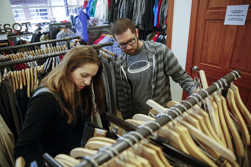 Shoppers browse clothing at the North Shore Rock/Creek store in this November photo. Tennessee Finance Commissioner Larry Martin said Friday that state tax collections are running $800 million above estimates for the first 1o months of the 2016 fiscal year.