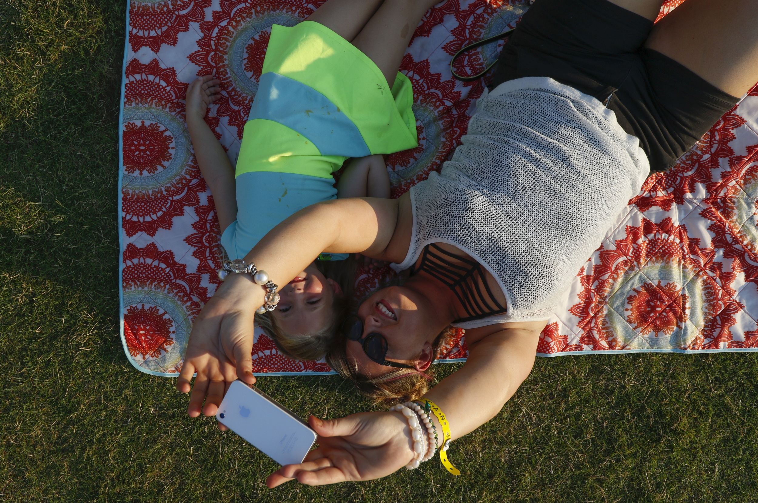 Staff Photo by Dan Henry / The Chattanooga Times Free Press- 6/12/16. Kara Burchard takes a selfie with her six-year-old daughter Bella Burchard during the 2016 Riverbend Music Festival in downtown Chattanooga on Sunday, June 12, 2016. This is the 35th year of the festival.