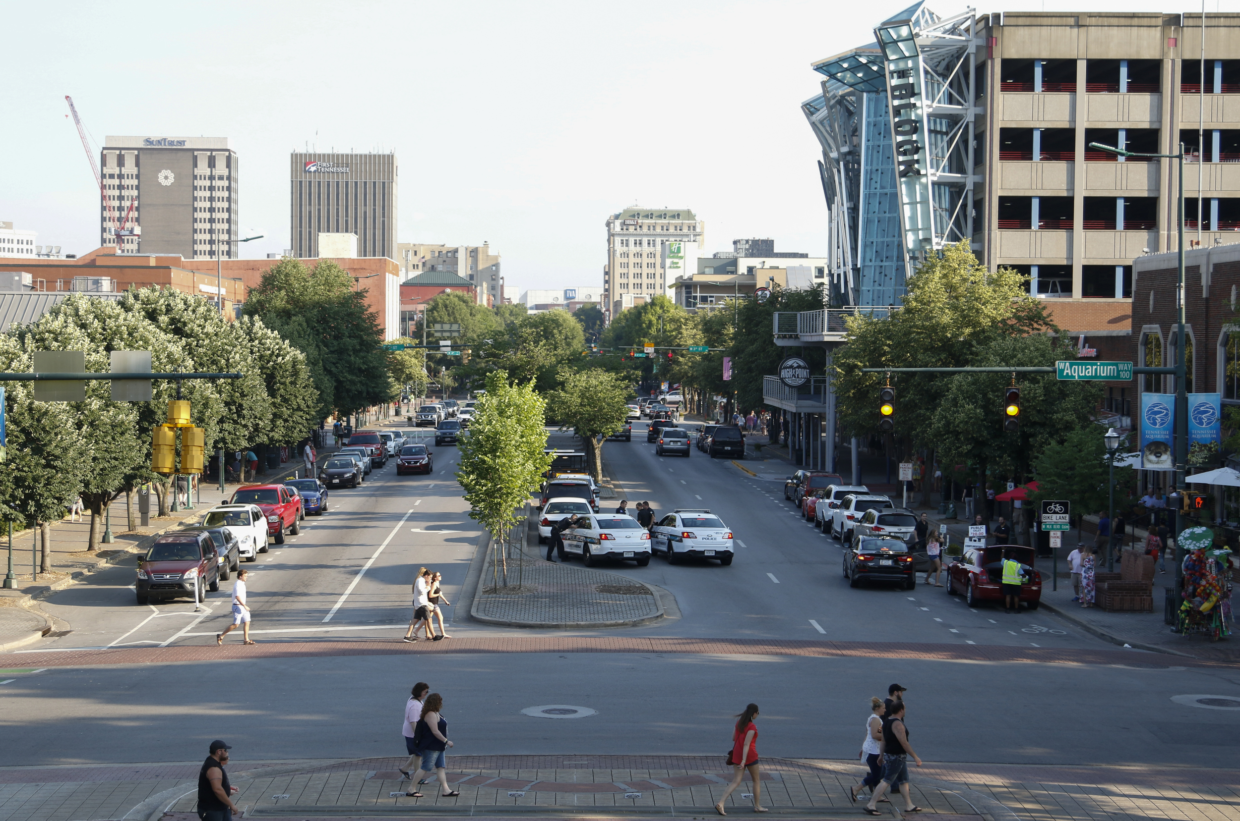 Staff Photo by Dan Henry / The Chattanooga Times Free Press- 6/12/16. Festival goers make their way towards the main entrance as parking fills up during the 2016 Riverbend Music Festival in downtown Chattanooga on Sunday, June 12, 2016. This is the 35th year of the festival.