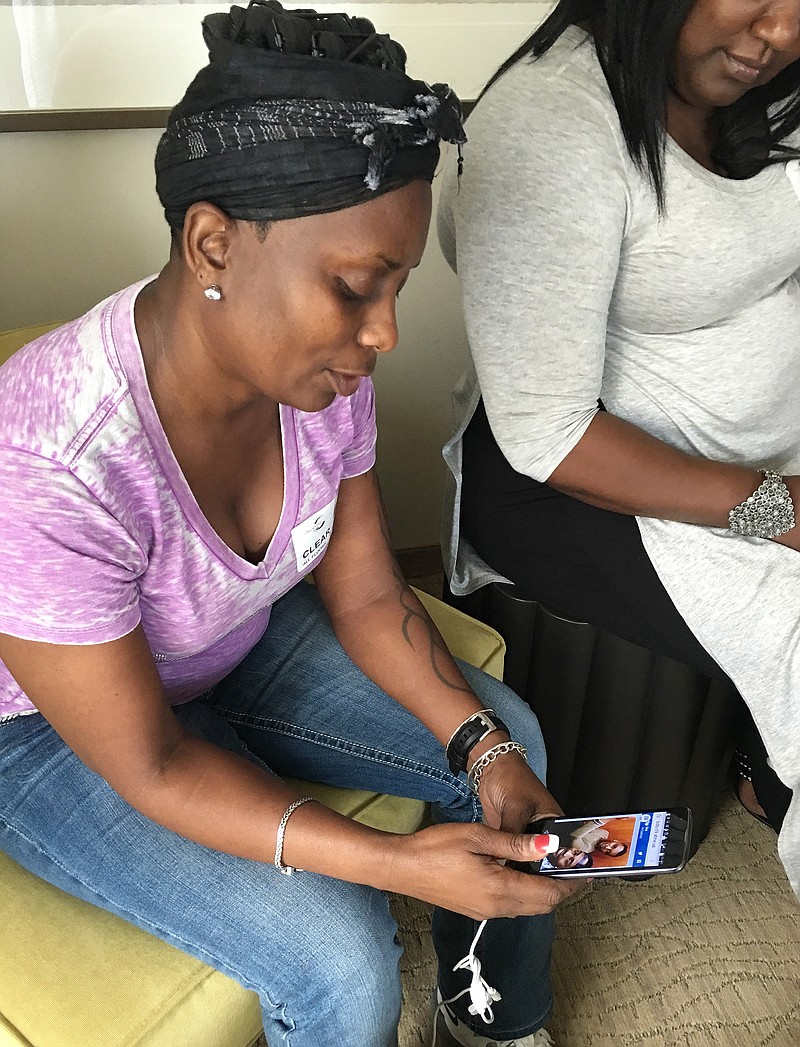 
              Mina Justice speaks to a reporter discussing texting with her son Eddie Justice who was in a bathroom at Club Pulse, Sunday June, 12, 2016, in Orlando. He hasn't been found today. A gunman wielding an assault-type rifle and a handgun opened fire inside a crowded gay nightclub early Sunday, killing at least 50 people before dying in a gunfight with SWAT officers, police said.It was the deadliest mass shooting in American history. (AP Photo/Tamara Lush)
            