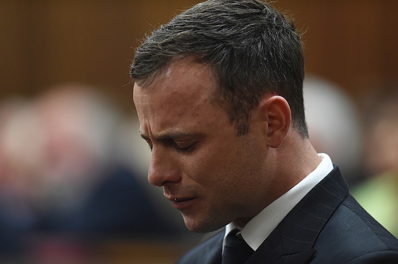 
              FILE - In this Sept 11, 2014 file photo Oscar Pistorius cries in the dock in Pretoria, South Africa, as Judge Thokozile Masipa reads notes as she delivers her verdict in Pistorius' murder trial. The double-amputee Olympian's sentencing hearing opens Monday, June 13, 2016, after he was convicted of murder by South Africa's Supreme Court for shooting girlfriend Reeva Steenkamp. (AP Photo/Phil Magakoe, Pool)
            