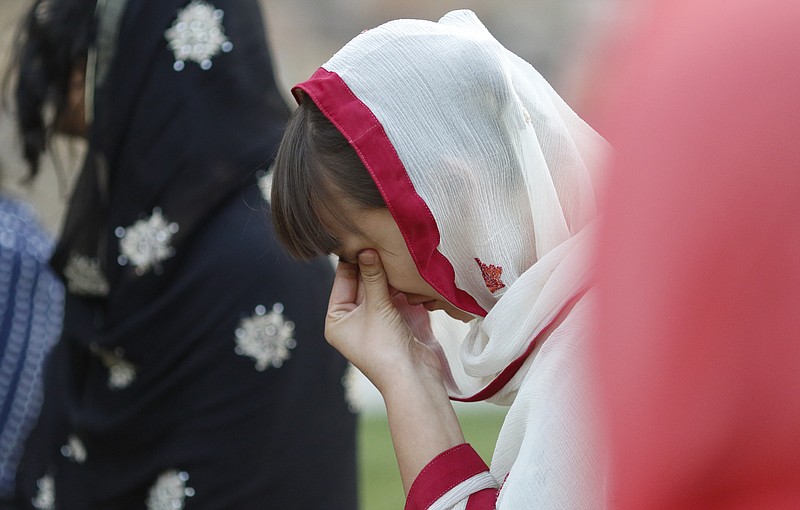 Staff Photo by Dan Henry / The Chattanooga Times Free Press- 6/12/16. Jenishea Lewis becomes emotional during a prayer vigil held with permission from the Islamic Society of Greater Chattanooga on Sunday, June 12, 2016. The vigil was in response to a mass shooting by an American-born man who pledged allegiance to ISIS killing 50 people early Sunday at a gay nightclub in Orlando, Florida. 