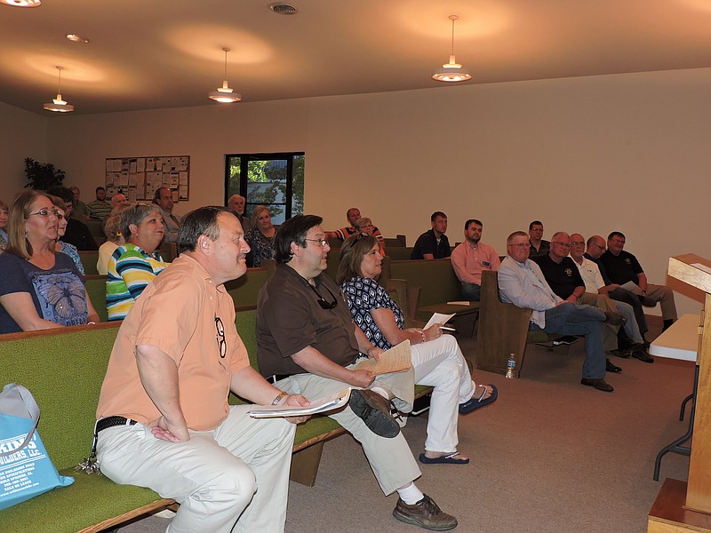 Rossville community members and speakers attend a Wilson Neighborhood Group meeting at Happy Believers Church.