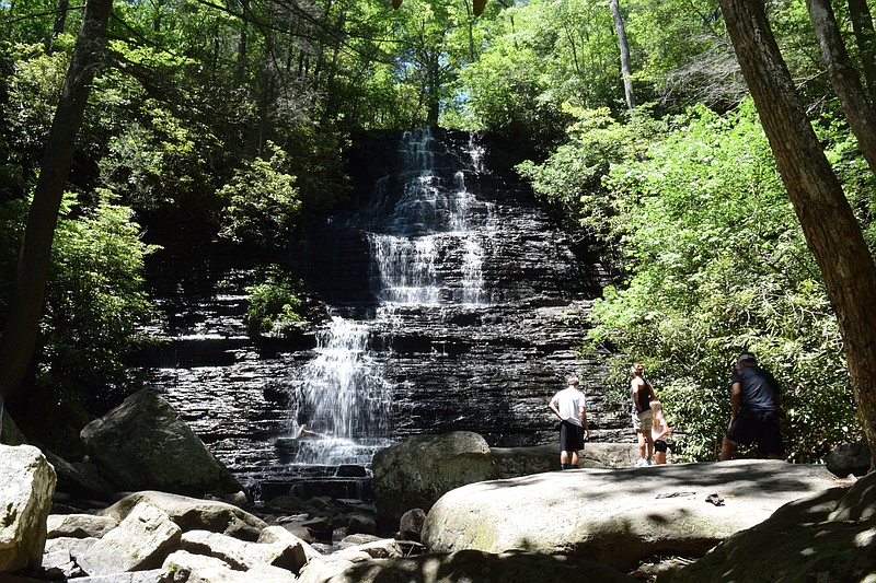Benton Falls is a 3.1-mile round-trip hike from the trailhead near McKamy Lake on Polk County, Tenn.'s Chilhowee Mountain. The 65-foot-high falls, which splash down step-like rocks, attract thousands of visitors a year. Here, visitors take in the cool spray and the roar of the falls on June 8, 2016. Benton Falls is a site included in a new brochure featuring 20 local waterfalls available through Tennessee Overhill Heritage Association based in Etowah, Tenn.