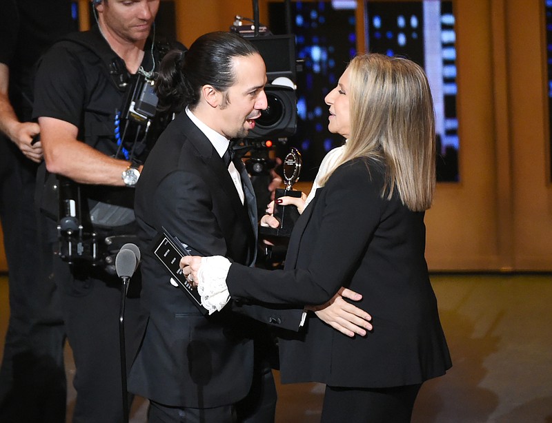 
              Barbra Streisand, right,  presents the award for best musical to Lin-Manuel Miranda of "Hamilton" at the Tony Awards at the Beacon Theatre on Sunday, June 12, 2016, in New York. (Photo by Evan Agostini/Invision/AP)
            