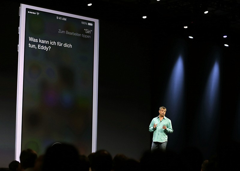 
              FILE - In this June 10, 2013, file photo, Eddy Cue, Apple senior vice president of internet software and services, talking about the new voices of Siri virtual assistant during the keynote address of the Apple Worldwide Developers Conference in San Francisco. Apple’s Siri made a big splash when the wisecracking digital assistant debuted in 2011. But as its competitors jockey to build intelligent “chat bots” and voice-controlled home systems capable of more challenging artificial-intelligence feats, Siri at times no longer seems cutting edge. On Monday, June 13, 2016, Apple is expected to demonstrate how much smarter Siri can get as it kicks off its annual software conference. (AP Photo/Eric Risberg, File)
            