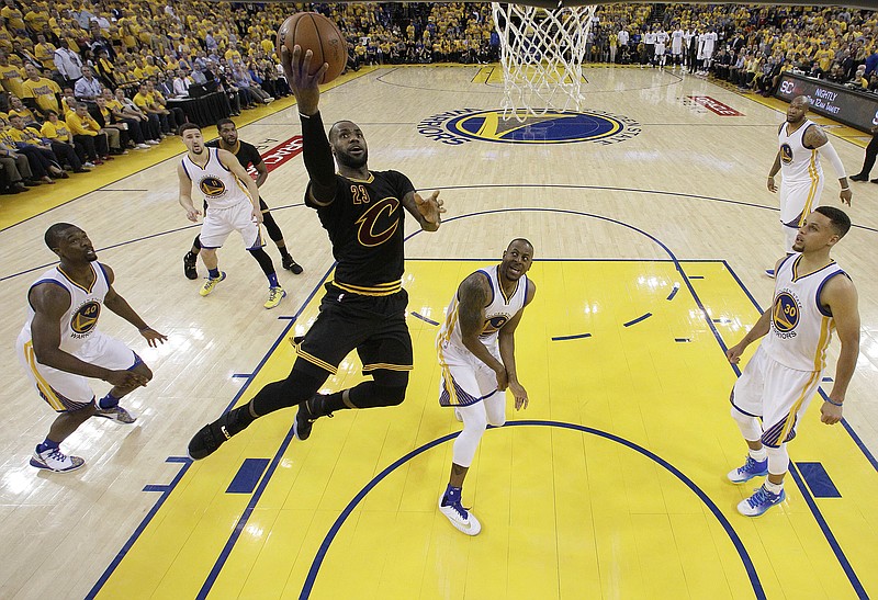 
              Cleveland Cavaliers forward LeBron James (23) shoots against the Golden State Warriors during the first half of Game 5 of basketball's NBA Finals in Oakland, Calif., Monday, June 13, 2016. (AP Photo/Marcio J. Sanchez, Pool)
            