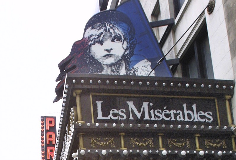 
              FILE- In this file photo from Tuesday, March 11, 2003, a marquee displays the advertisement for theater show Les Miserables, in New York. A kiss between two male actors has been removed from a production of the musical “Les Miserables” in Singapore following complaints from the public. Singapore’s Media Development Authority told the show’s organizer that the “General” rating it had given the show was based on a script that did not include the same-sex kiss, local media reports said Monday. (AP Photo/Tina Fineberg, File)
            