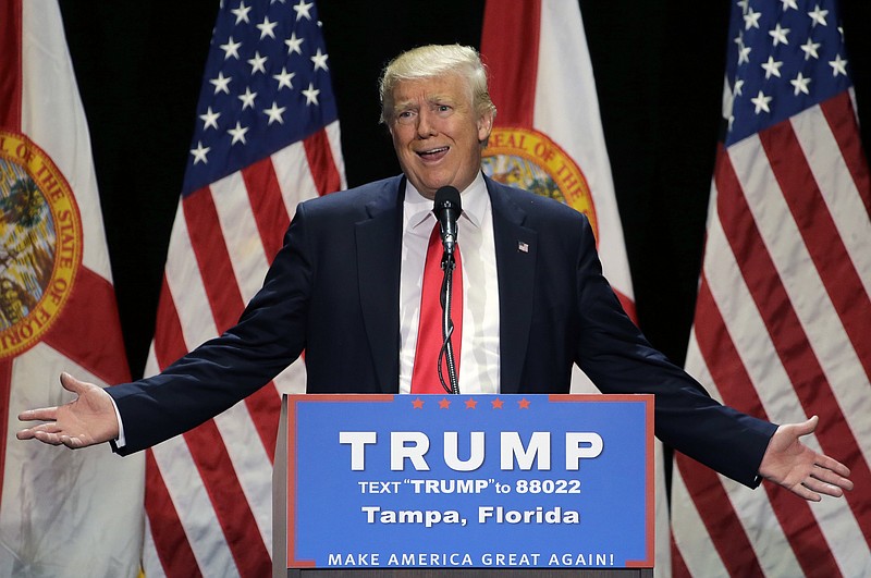 
              File- This June 11, 2016 file photo shows Republican presidential candidate Donald Trump gesturing during a campaign speech in Tampa, Fla. Trump plans Monday to further address the deadliest shooting in modern U.S. history in a campaign speech originally intended to attack the presumptive Democratic nominee, Hillary Clinton. The switch comes a day after Trump called for Clinton to drop out of the race for president if she didn’t use the words “radical Islam” to describe the Florida nightclub massacre. (AP Photo/Chris O'Meara, File)
            