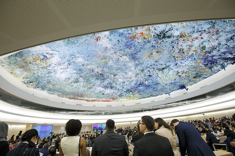 
              Delegates gather  during the opening of the 32th session of the Human Rights Council, at the European headquarters of the United Nations in Geneva, Switzerland, Monday, June 13, 2016.  (Salvatore Di Nolfi/Keystone via AP)
            