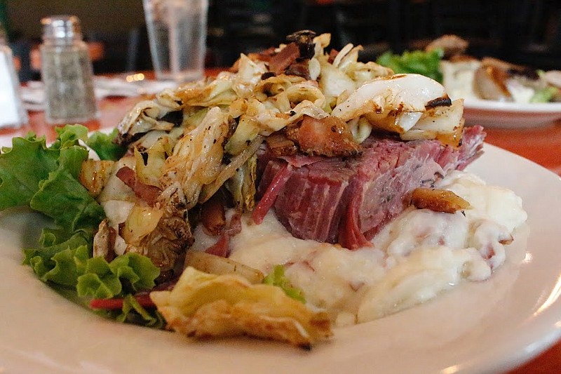 Leapin' Leprechaun's corned beef and smash features a giant slab of brisket in sautéed cabbage on a bed of garlic mashed potatoes. The restaurant recently opened at 101 Market St. downtown.