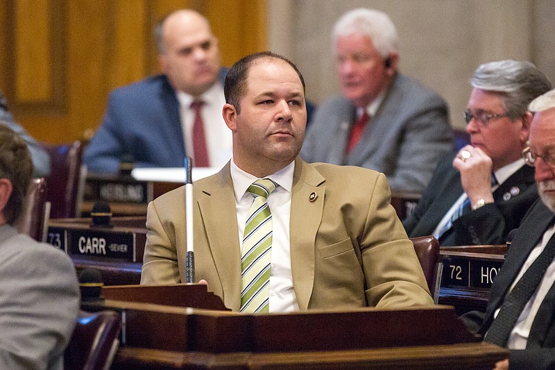 
              FILE - In this is April 6, 2016, file photo, Rep. Andy Holt, R-Dresden, attends a House floor debate in Nashville, Tenn. Holt said on Tuesday, June 14, 2016, that his office has received threats for his plans to hold a political fundraiser featuring a giveaway of the same type of semi-automatic rifle used by a gunman in the massacre of 49 people at an Orlando nightclub. (AP Photo/Erik Schelzig, file)
            
