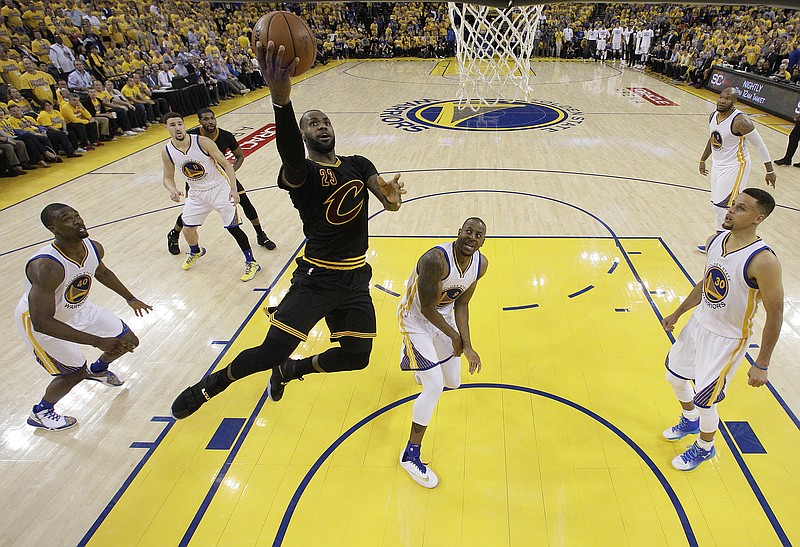 Cleveland Cavaliers forward LeBron James (23) shoots against the Golden State Warriors during the first half of Game 5 of basketball's NBA Finals in Oakland, Calif., Monday, June 13, 2016. (AP Photo/Marcio J. Sanchez, Pool)