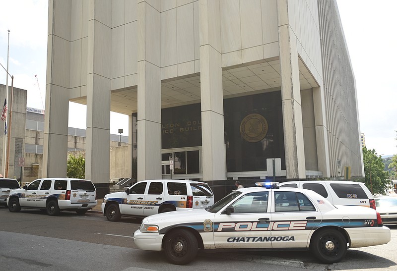 Police vehicles line the street Wednesday, June 15, 2016, outside of the Hamilton County Jail.