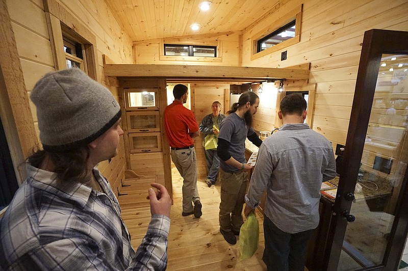 In this 2015 file photo, attendees examine the Little Digs tiny home and Ready Family display during the Tri-State Home Show at the Chattanooga Convention Center.