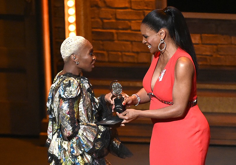 
              Cynthia Erivo, left, accepts the award for leading actress in a musical for "The Color Purple" from presenter Audra McDonald at the Tony Awards at the Beacon Theatre on Sunday, June 12, 2016, in New York. (Photo by Evan Agostini/Invision/AP)
            