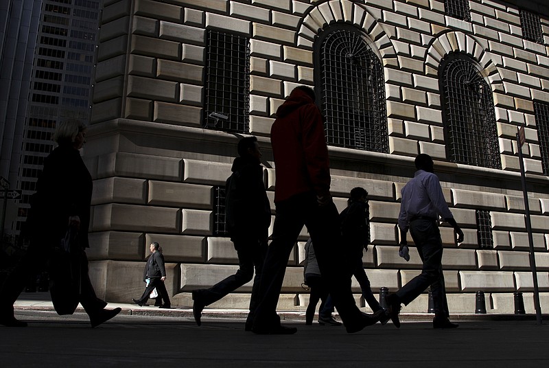 
              FILE - In this Thursday, Oct. 18, 2012, file photo, pedestrians walk past the Federal Reserve Bank of New York, in New York. On Wednesday, June 15, 2016, the Federal Reserve Bank of New York reports on factory activity in New York in June as indicated by its Empire State manufacturing index. (AP Photo/Seth Wenig, File)
            