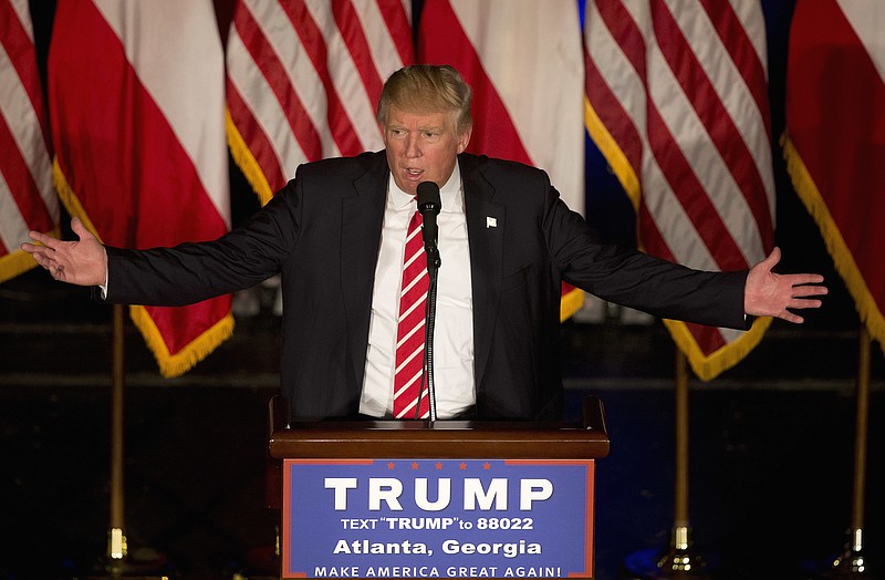 
              Republican presidential candidate Donald Trump gestures as he speaks during a rally at the Fox Theater, Wednesday, June 15, 2016, in Atlanta. (AP Photo/John Bazemore)
            