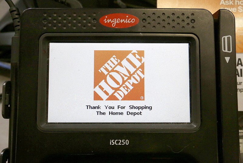 
              In this Wednesday, May 18, 2016, photo, the Home Depot logo appears on a credit card reader at a Home Depot store in Bellingham, Mass. The Home Depot Inc. says in a new federal lawsuit that Visa and MasterCard are using security measures prone to fraud, putting it and other retailers at risk of hacking attacks by cyber thieves. Atlanta-based Home Depot says new payment cards with so-called "chip" technology, rolled out in the U.S. in recent years, remain less secure than cards used in Europe and elsewhere in the world. (AP Photo/Steven Senne)
            
