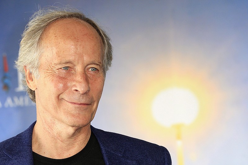 
              FILE - This is a Tuesday, Sept. 3, 2013 file photo of American novelist and short story writer, Richard Ford, as he poses during a photo call at the 39th American Film Festival, in Deauville, Normandy, western France. U.S. writer Richard Ford, author of the widely acclaimed novel “Independence Day,” has won Spain's prestigious Asturias prize for literature in recognition of his contribution to American letters.  The award foundation Wednesday June 15, 2016  described Ford, 72, as the “great chronicler of the mosaic of interrelated stories that is North American society,” and the considered heir to U.S. literary giants, Ernest Hemingway and William Faulkner.  (AP Photo/Lionel Cironneau, File)
            
