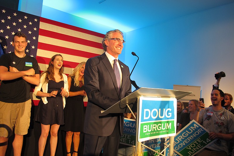 
              Republican governor candidate Doug Burgum talks to supporters at an art gallery in downtown Fargo, N.D., after Burgum won the GOP primary vote on Tuesday, June 14, 2016. Burgum, a Fargo businessman, defeated Attorney General Wayne Stenehjem, who was endorsed at the state Republican Party convention. (AP Photo/Dave Kolpack)
            