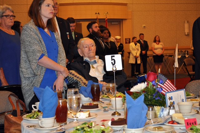 Medal of Honor recipient Charles Coolidge, seated, for whom the center is named.