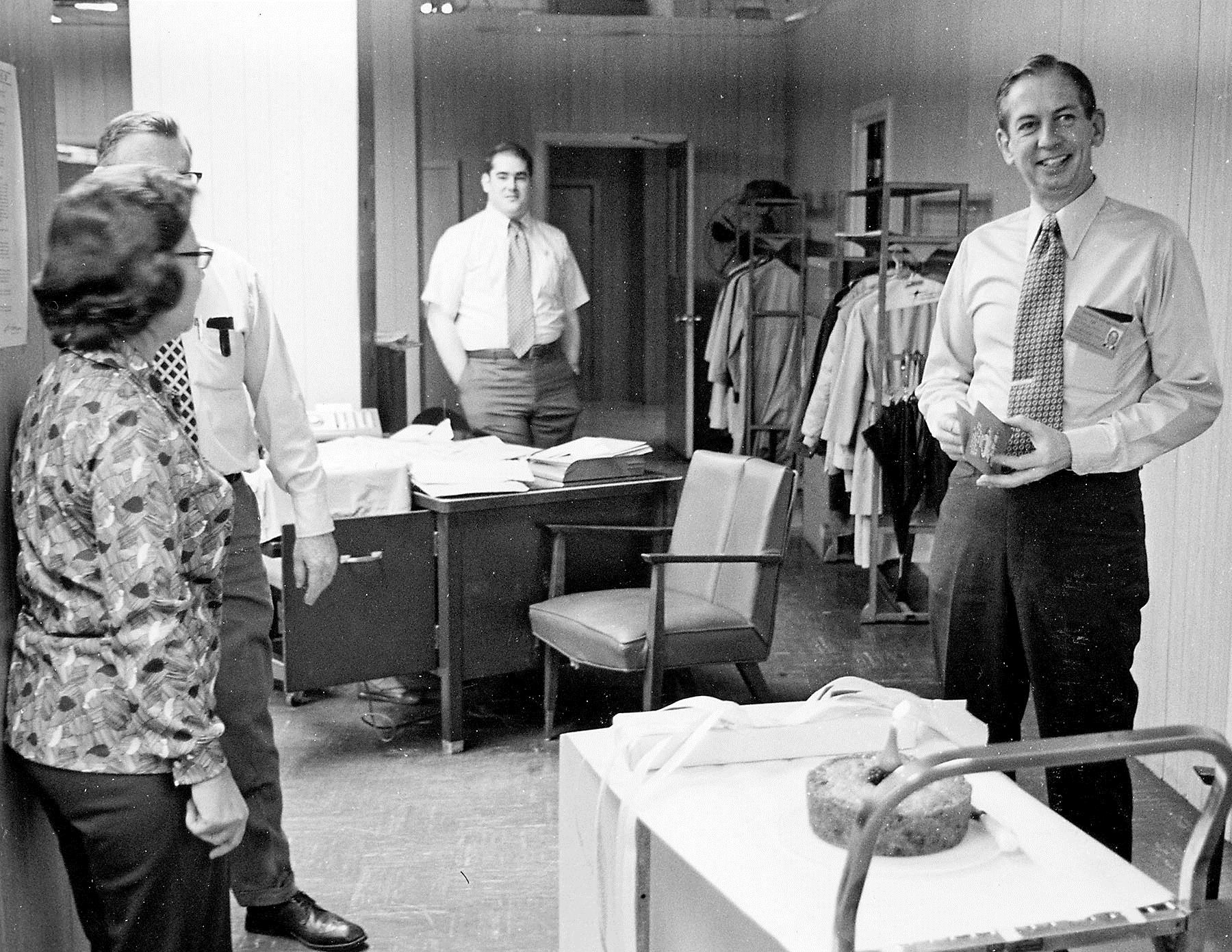 Lee Anderson, far right, is honored at a newsroom celebration in 1972.