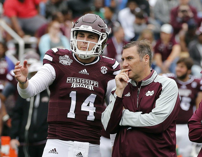 Former Baylor School quarterback Nick Tiano talks with Mississippi State coach Dan Mullen during the team's spring game on April 16.