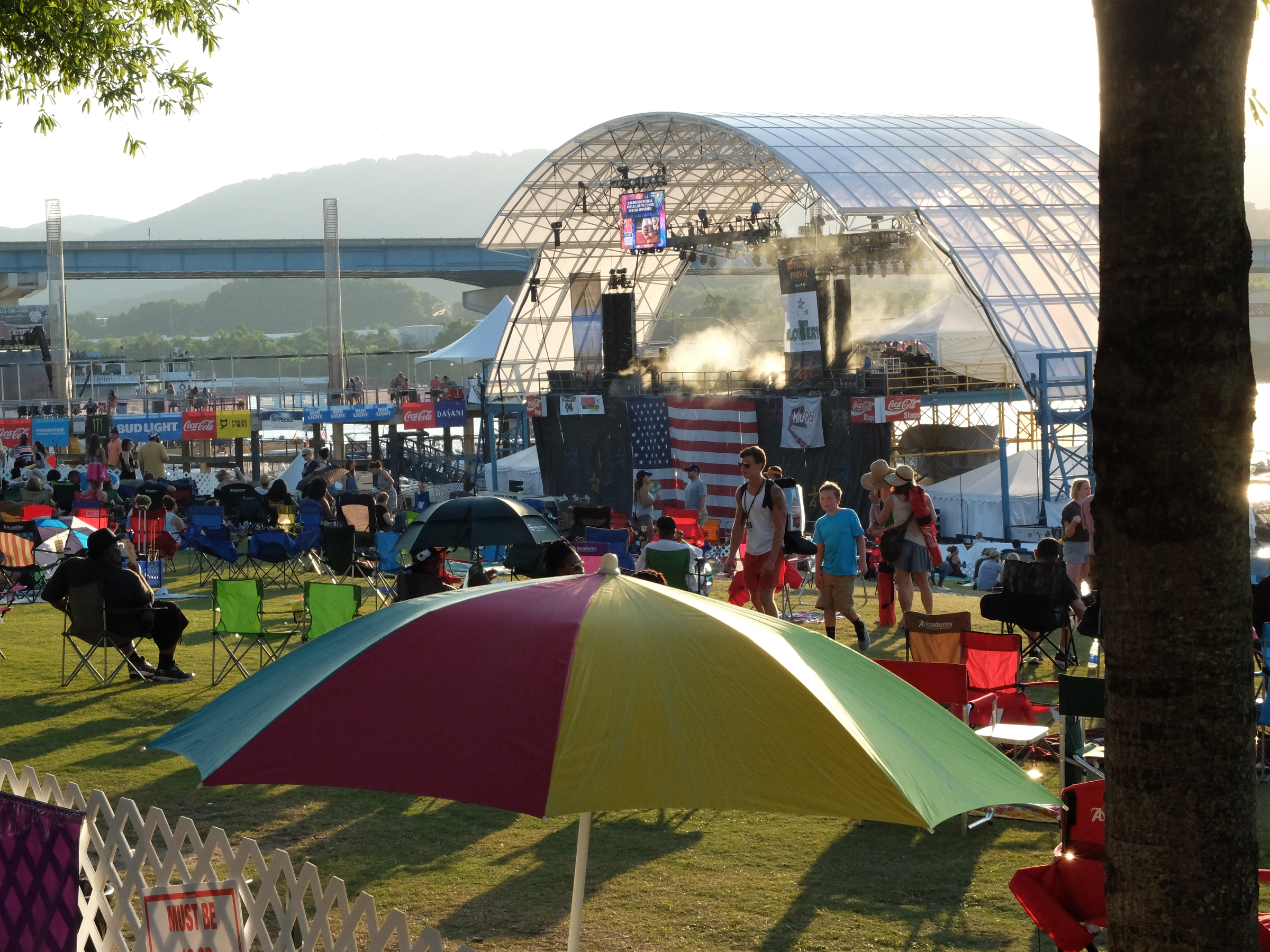 A cooling mist wafts over the deck of the Coca-Cola Stage as mid-90s keep Riverbend goers seeking shade.