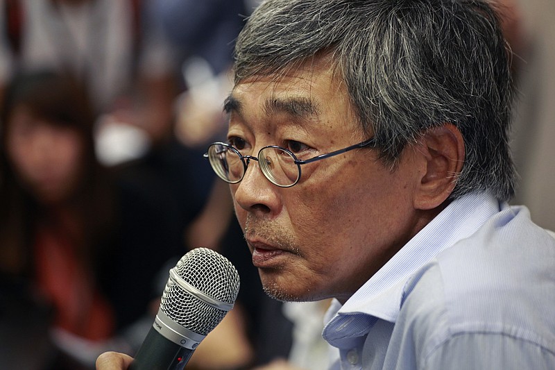 
              Freed Hong Kong bookseller Lam Wing-kee listens to reporter's questions during a news conference in Hong Kong Thursday, June 16, 2016. Lam detailed his experience in custody in mainland China during his months long disappearance that has raised concern in Hong Kong that mainland authorities are undermining the territory's autonomy and rule of law. (AP Photo/Vincent Yu)
            