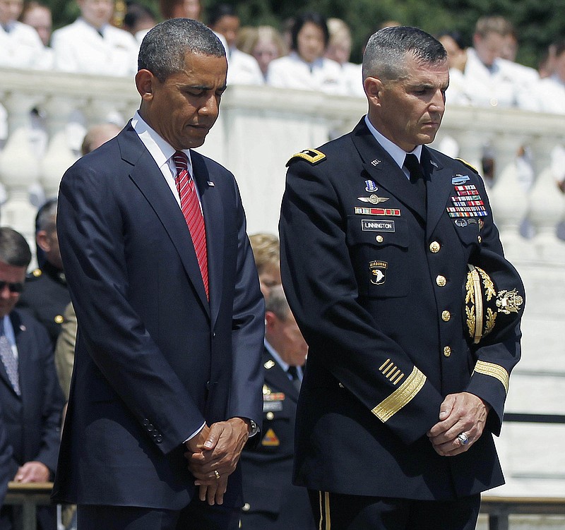 
              This May 28, 2012 file photo shows President Barack Obama standing with Maj. Gen. Michael S. Linnington, Commander of the U.S. Army Military District of Washington, during a Memorial Day wreath-laying ceremony at the Tomb of the Unknowns at Arlington National Cemetery in Arlington, Va. Linnington, now retired from the military, plans to leave his post as director of the Defense POW/MIA Accounting Agency to become the CEO of the Wounded Warrior Project, Thursday, June 16. 2016. (AP Photo/Pablo Martinez Monsivais, File)
            
