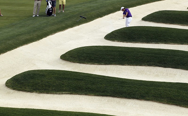 
              Mike Miller hits out of the bunker on the 15th hole during a practice round for the U.S. Open golf championship at Oakmont Country Club on Wednesday, June 15, 2016, in Oakmont, Pa. (AP Photo/Charlie Riedel)
            