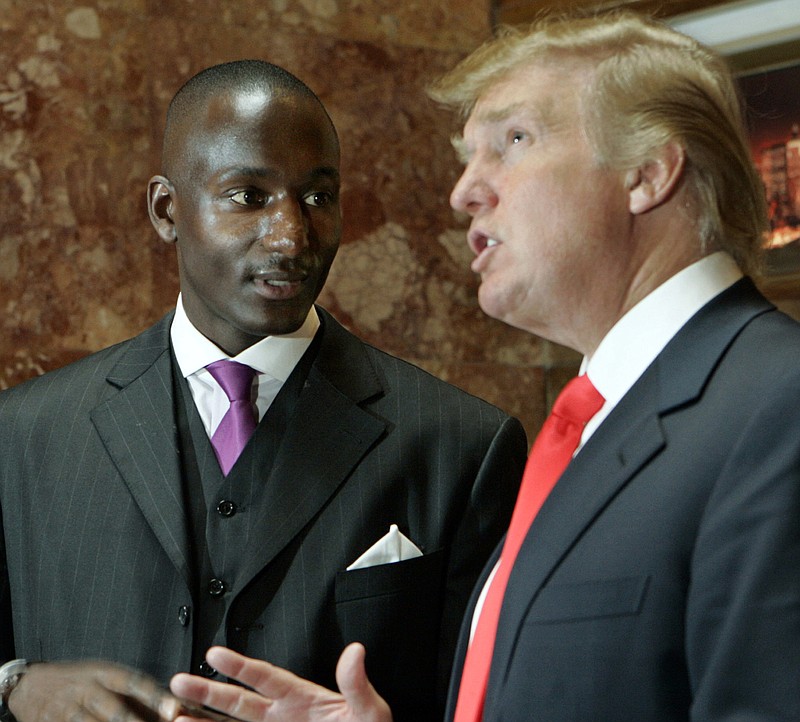 
              FILE - In this March 24, 2006 file photo, Donald Trump speaks to Randal Pinkett, the winner of the fourth season of Trump's reality television show "The Apprentice," at the sixth season auditions at Trump Tower in New York. There are few, if any, black executives in the upper ranks of the Trump Organization, a review by The Associated Press has found. During his tenure as temporary VP within Trump Entertainment Resorts, Inc., Pinkett noticed the absence of minority executives in the organization, saying: “It was quite commonplace for me to be the only person of color in the room for meetings at the executive level.” (AP Photo/Stuart Ramson, File)
            