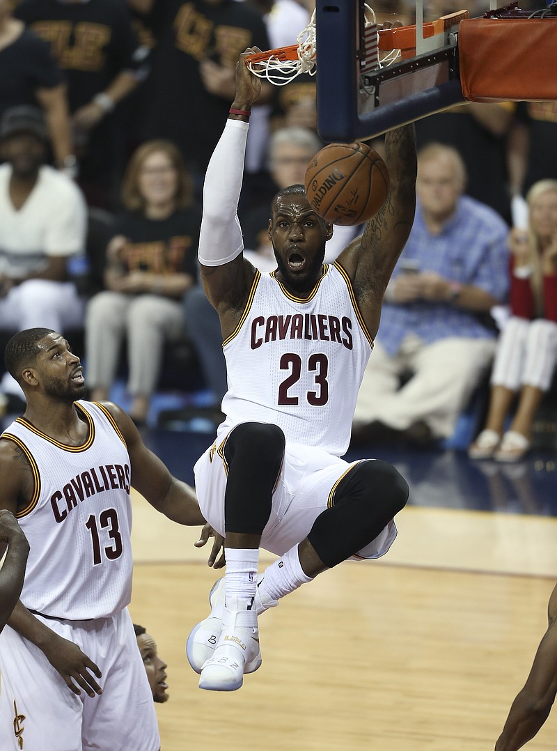 
              Cleveland Cavaliers forward LeBron James (23) dunks against the Golden State Warriors during the first half of Game 6 of basketball's NBA Finals in Cleveland, Thursday, June 16, 2016. (AP Photo/Ron Schwane)
            