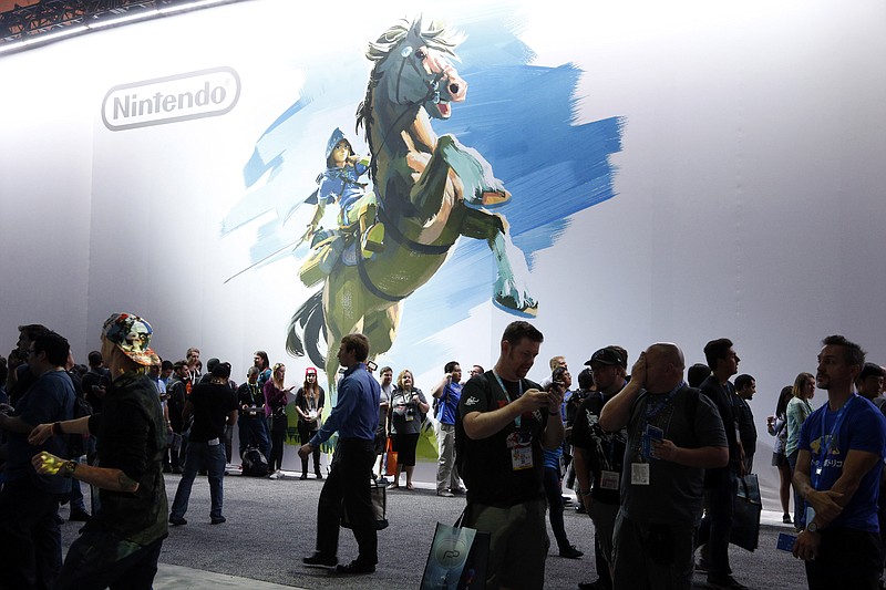 
              Attendees visit the Nintendo exhibit at the Electronic Entertainment Expo in Los Angeles on Wednesday, June 15, 2016. (AP Photo/Nick Ut)
            
