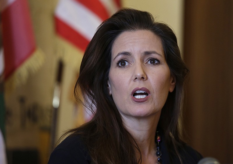
              File- This June 15, 2016, file photo shows Oakland Mayor Libby Schaaf answering questions during a news conference at City Hall in Oakland, Calif. Another Oakland police chief has stepped down after two days on the job. Acting Police Chief Paul Figueroa is the third chief to be replaced in nine days amid a sex scandal that the city's mayor said involved "disgusting allegations" that a number of officers had sex with a teenage prostitute. Schaaf said Friday, June 17, 2016,  her job is to "run a police department, not a frat house." (AP Photo/Eric Risberg, File)
            