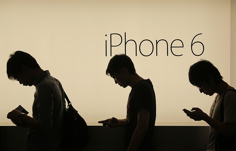 
              FILE - In this Friday, Sept. 19, 2014, file photo, people wait to buy the new Apple iPhone 6 and 6 Plus devices outside an Apple store in Hong Kong. Apple is embroiled in a Chinese patent dispute that threatens to block future sales of the iPhone 6 in Beijing unless the company can overturn a regulator's recent ruling. The potential ban stems from a decision issued in May 2016 by the Beijing Intellectual Property Office. The agency found the iPhone 6 and iPhone 6 Plus infringed on a Chinese company's patent for the exterior design of its smartphone called the 100C. (AP Photo/Vincent Yu, File)
            