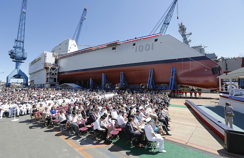 
              A crowd watches the christening ceremony for the Zumwalt-class guided missile destroyer Michael Monsoor (DDG 1001) Saturday, June 18, 2016 at Bath Iron Works in Bath, Maine. (Joel Page/Portland Press Herald via AP) MANDATORY CREDIT
            