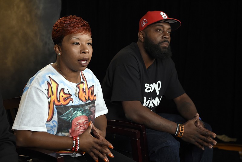 
              FILE - In this Sept. 27, 2014 file photo, the parents of Michael Brown, Lesley McSpadden, left, and Michael Brown, Sr., right, sit for an interview with The Associated Press in Washington. Attorneys representing Ferguson, Mo., its former police chief and an ex-officer in a wrongful-death lawsuit by Brown's parents are pressing the latest quest for access to any of the late 18-year-old's juvenile records. Anthony Gray, a Brown family attorney, has said any brush by Brown with the juvenile court system is irrelevant to whether Brown's 2014 death resulted from excessive police force.(AP Photo/Susan Walsh, File)
            