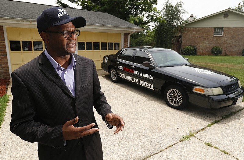 Staff Photo by Dan Henry / The Chattanooga Times Free Press- 5/25/16. Local Nation of Islam Leader Kevin Muhammad speaks about a patrol car he led the community in purchasing in addition to establishing a hotline to assist people in resolving conflict. These steps are among many he's taking to help inner city communities alleviate violence.