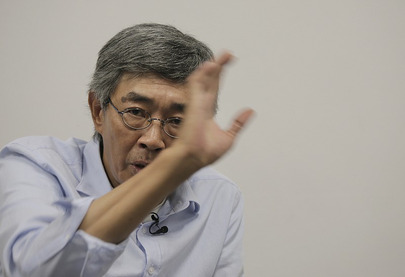 
              Hong Kong bookseller Lam Wing-kee speaks during an interview in Hong Kong, Sunday, June 19, 2016. The Hong Kong bookseller whose disappearance sparked international concern says he was so despondent during his detention by authorities in mainland China that he considered suicide. In an interview Sunday, Lam told The Associated Press that he thought about using his clothes to hang himself but couldn't find a way to do it in the small room where he was kept under constant watch for five months. (AP Photo/Vincent Yu)
            